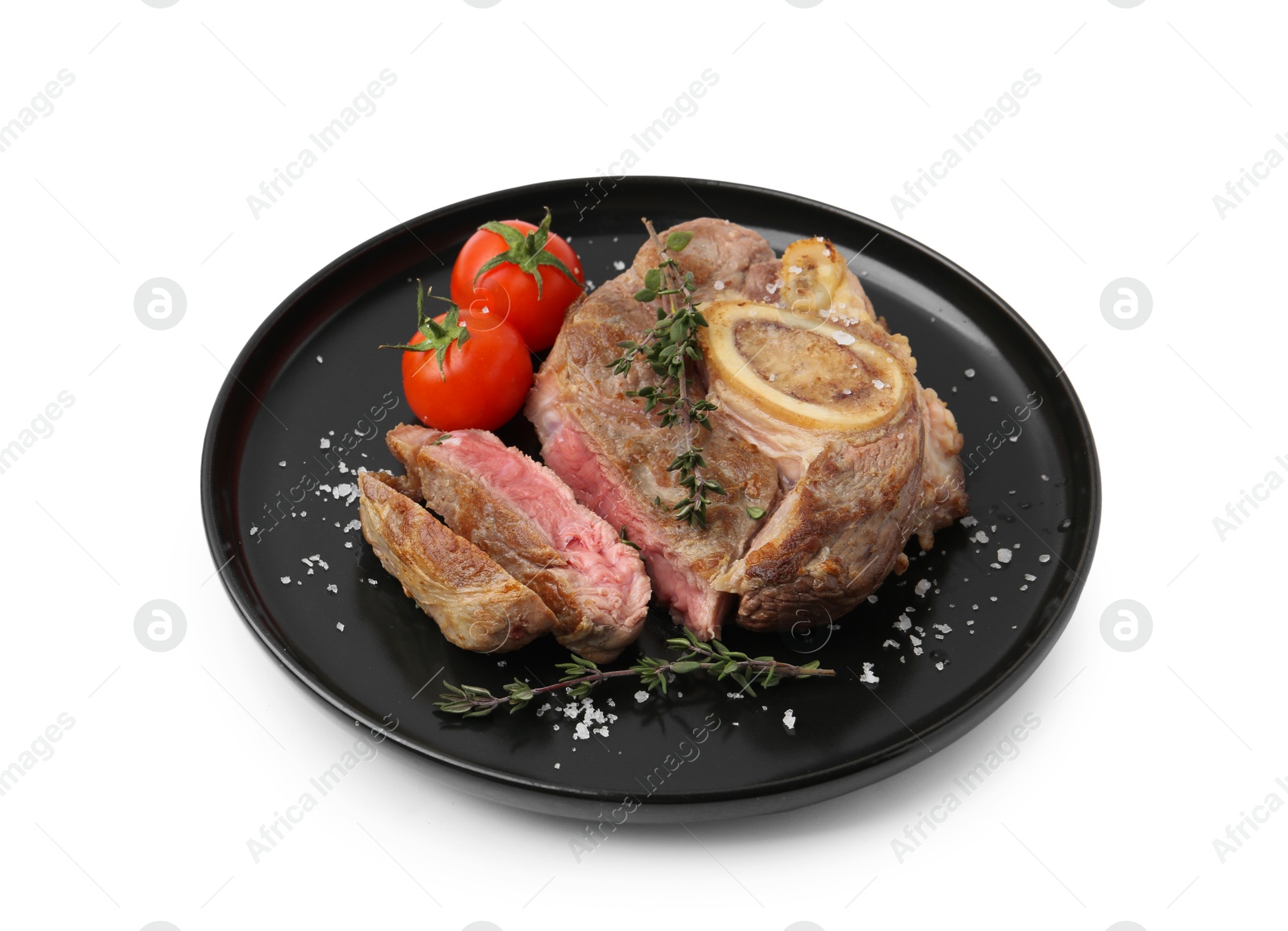 Photo of Pieces of delicious beef meat, thyme, salt and tomatoes isolated on white