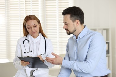 Man having appointment with cardiologist in clinic