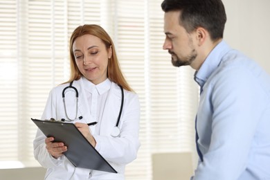 Photo of Man having appointment with cardiologist in clinic