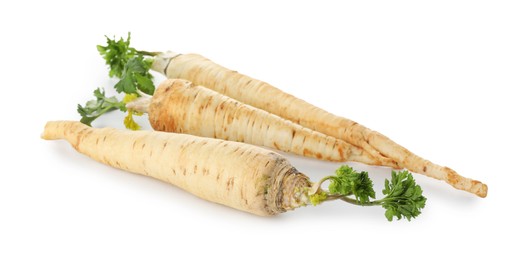 Photo of Three fresh parsley roots isolated on white