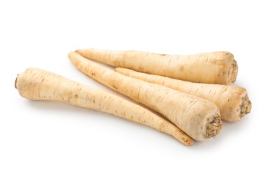 Photo of Many fresh parsley roots isolated on white