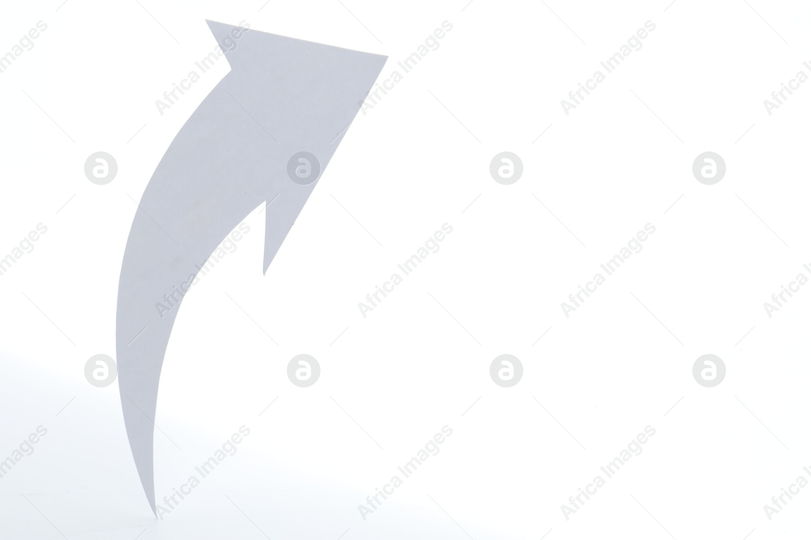 Photo of One cutout paper arrow isolated on white