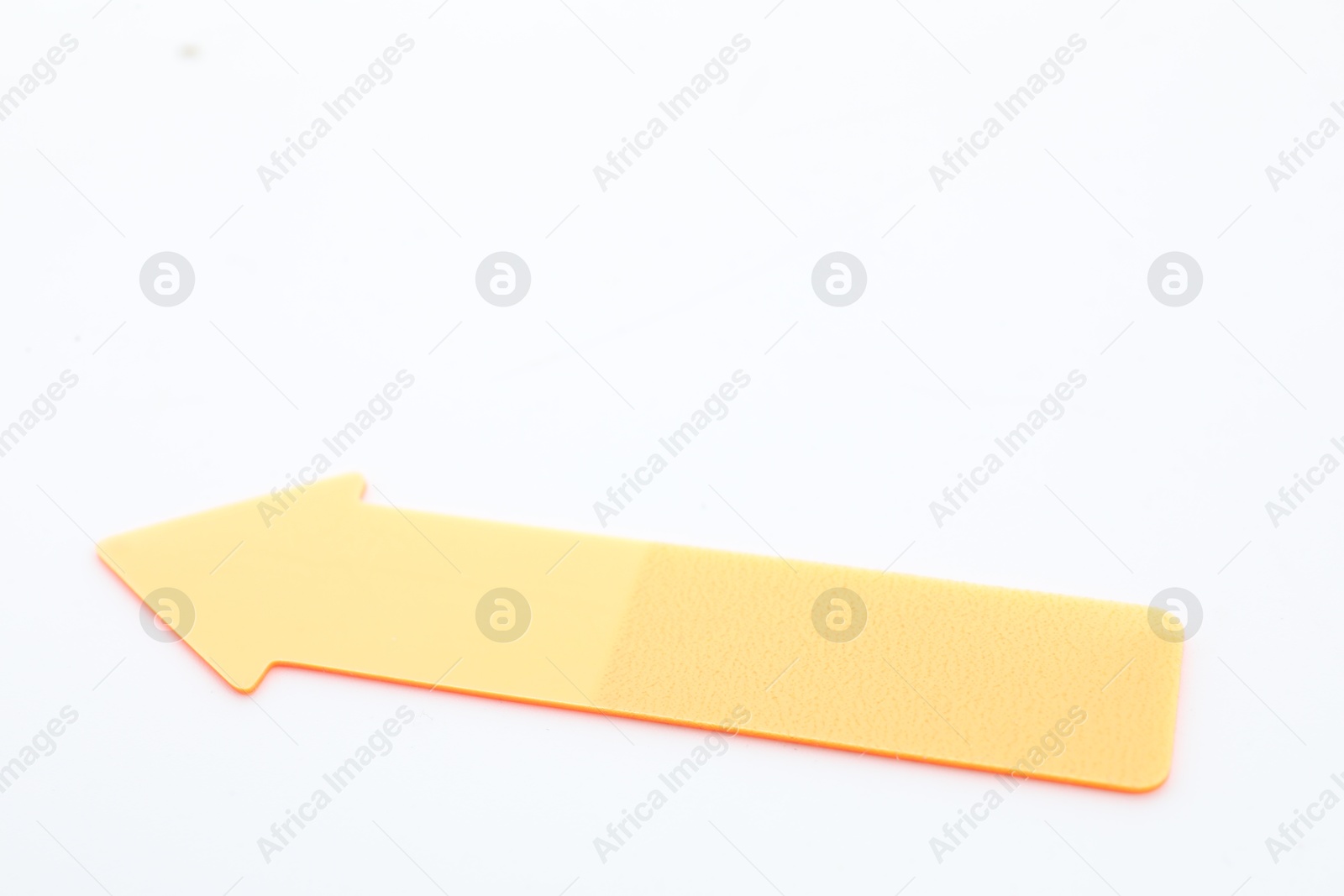 Photo of One color paper arrow isolated on white