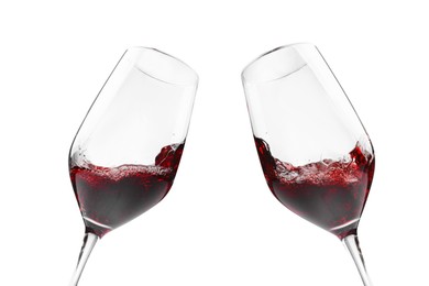 Image of Glasses of splashing red wine isolated on white