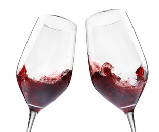 Image of Glasses of splashing red wine isolated on white