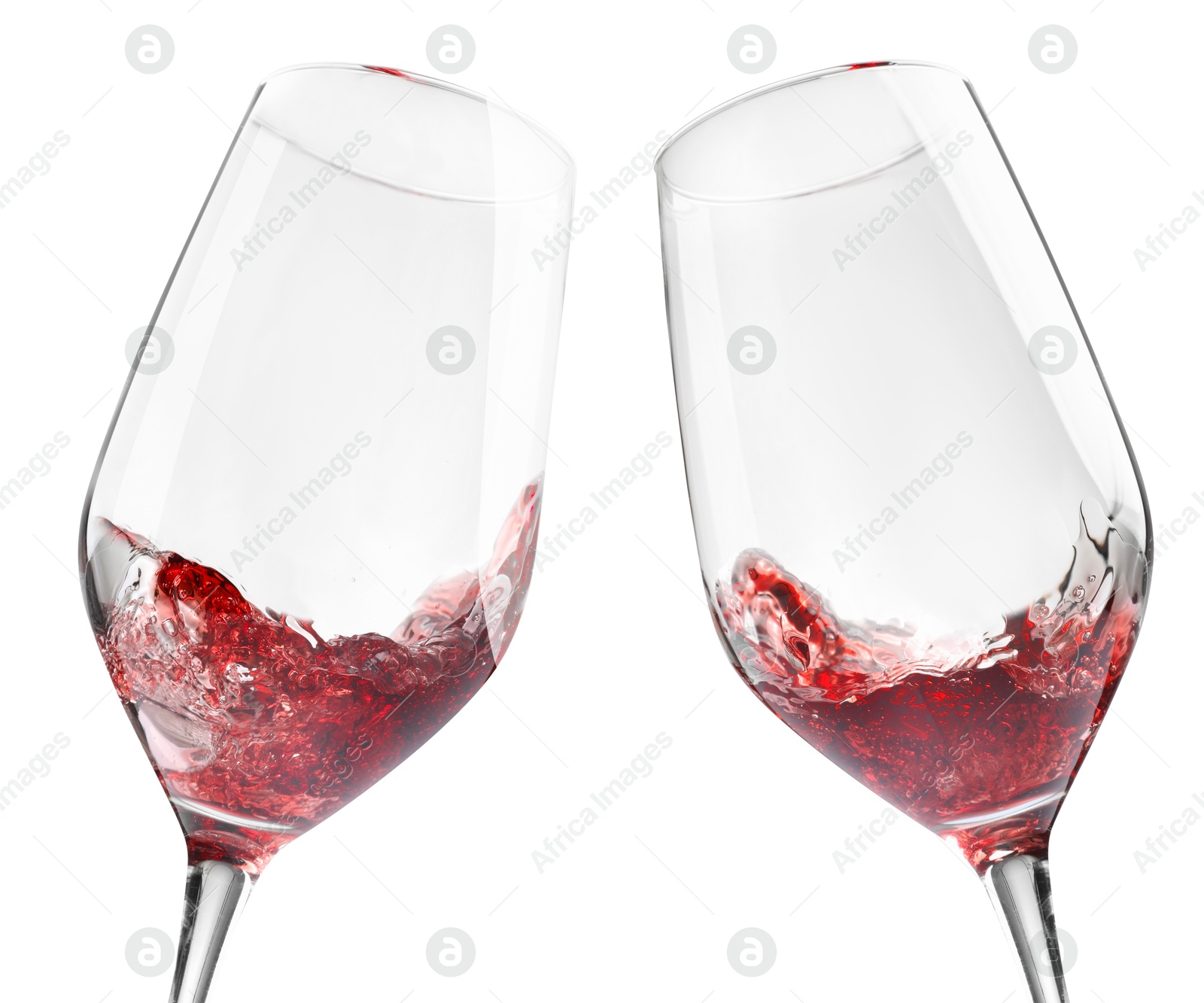 Image of Glasses of splashing red wine isolated on white