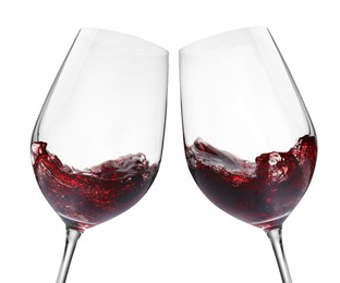 Image of Glasses of splashing red wine isolated on white