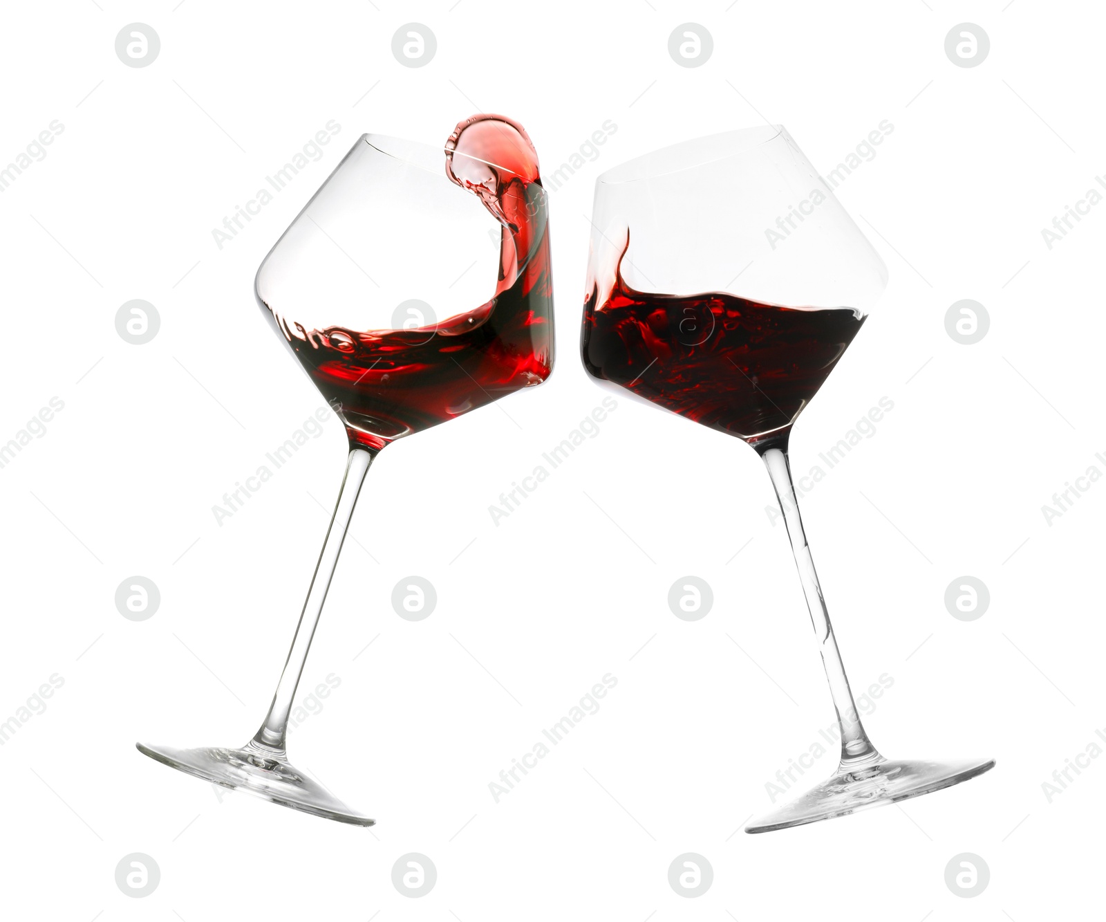 Image of Glasses of splashing red wine isolated on white