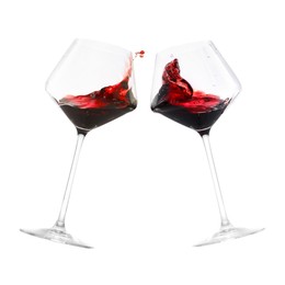 Image of Glasses of splashing red wine isolated on white