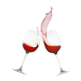 Image of Glasses of splashing red wine isolated on white