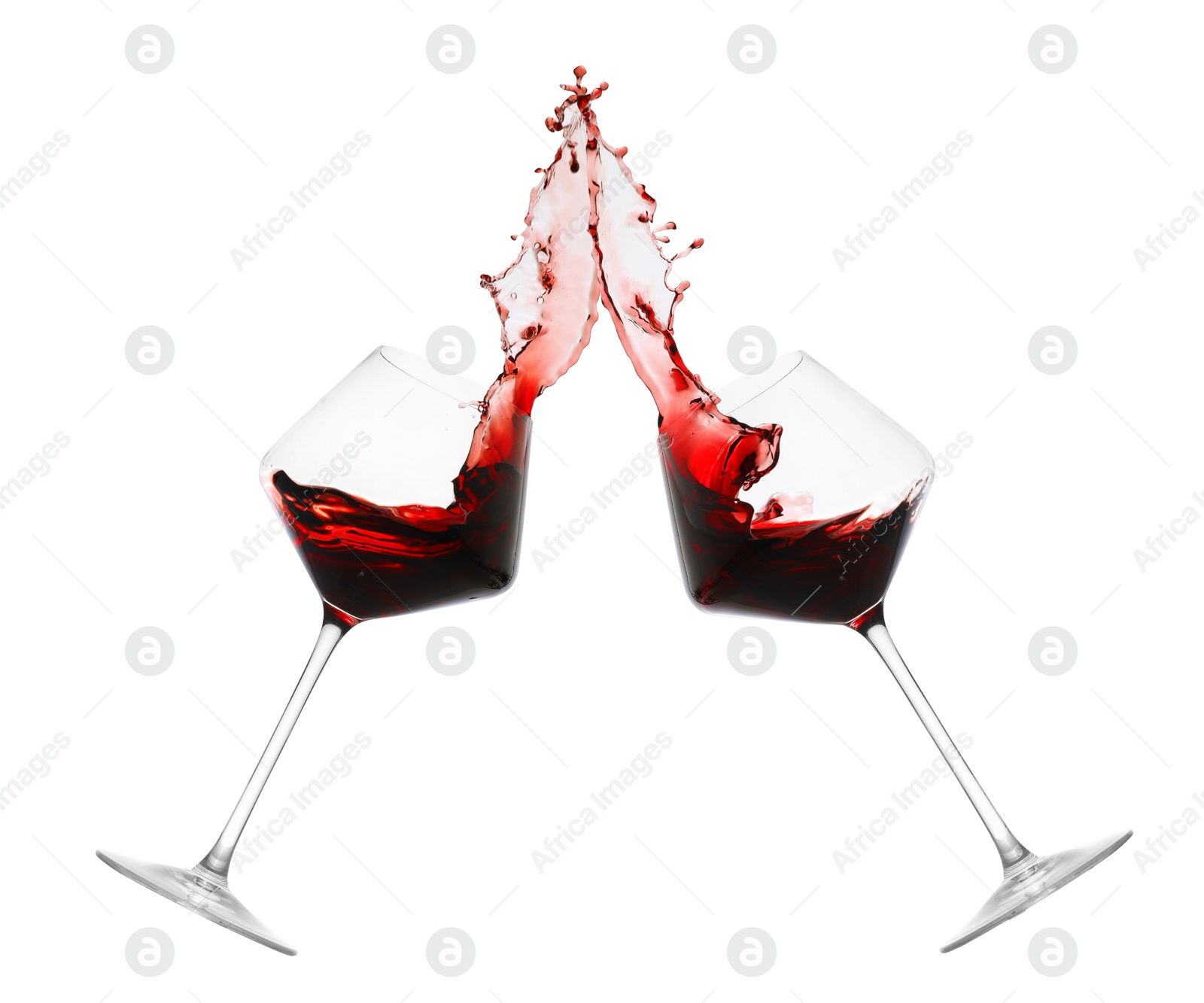 Image of Glasses of splashing red wine isolated on white