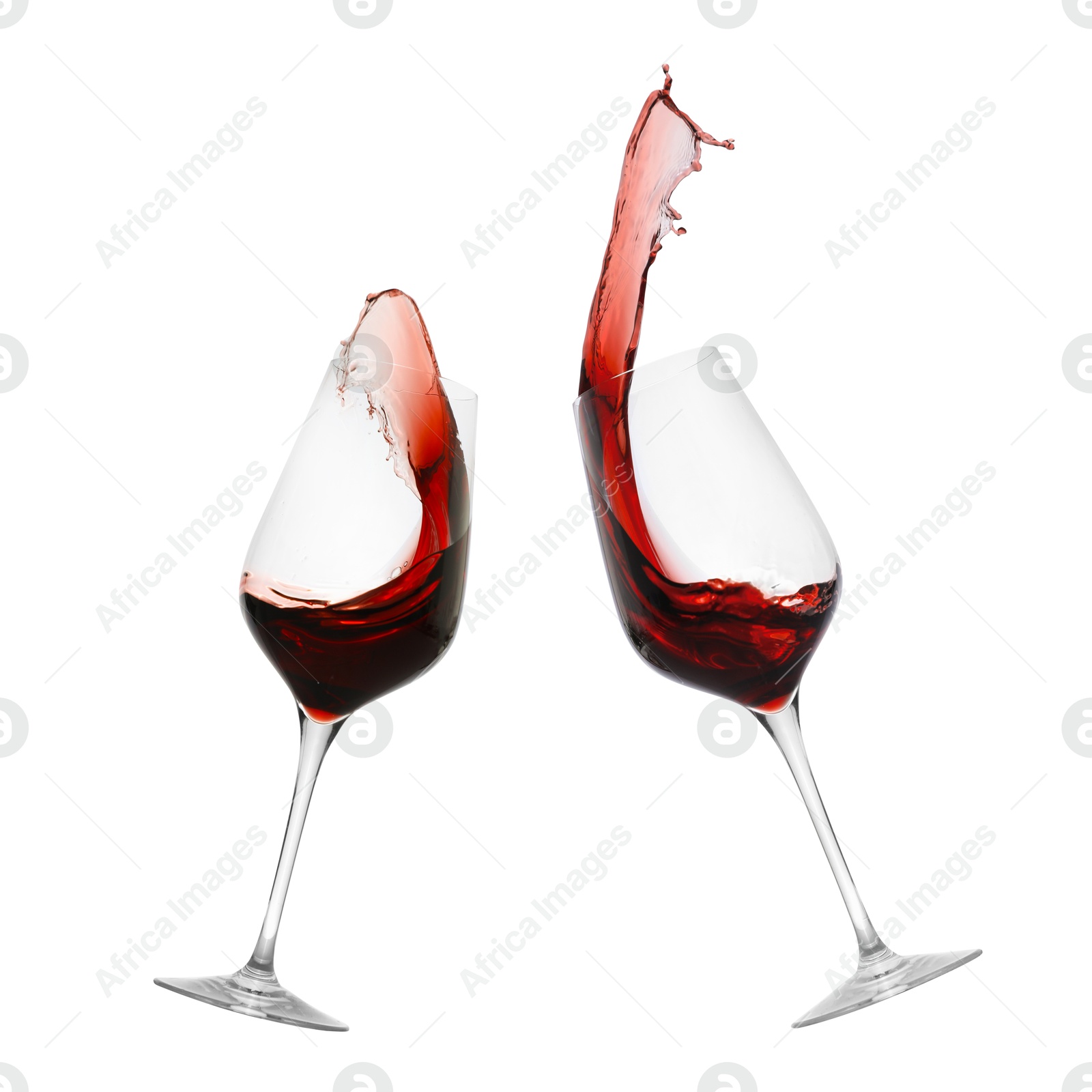 Image of Glasses of splashing red wine isolated on white