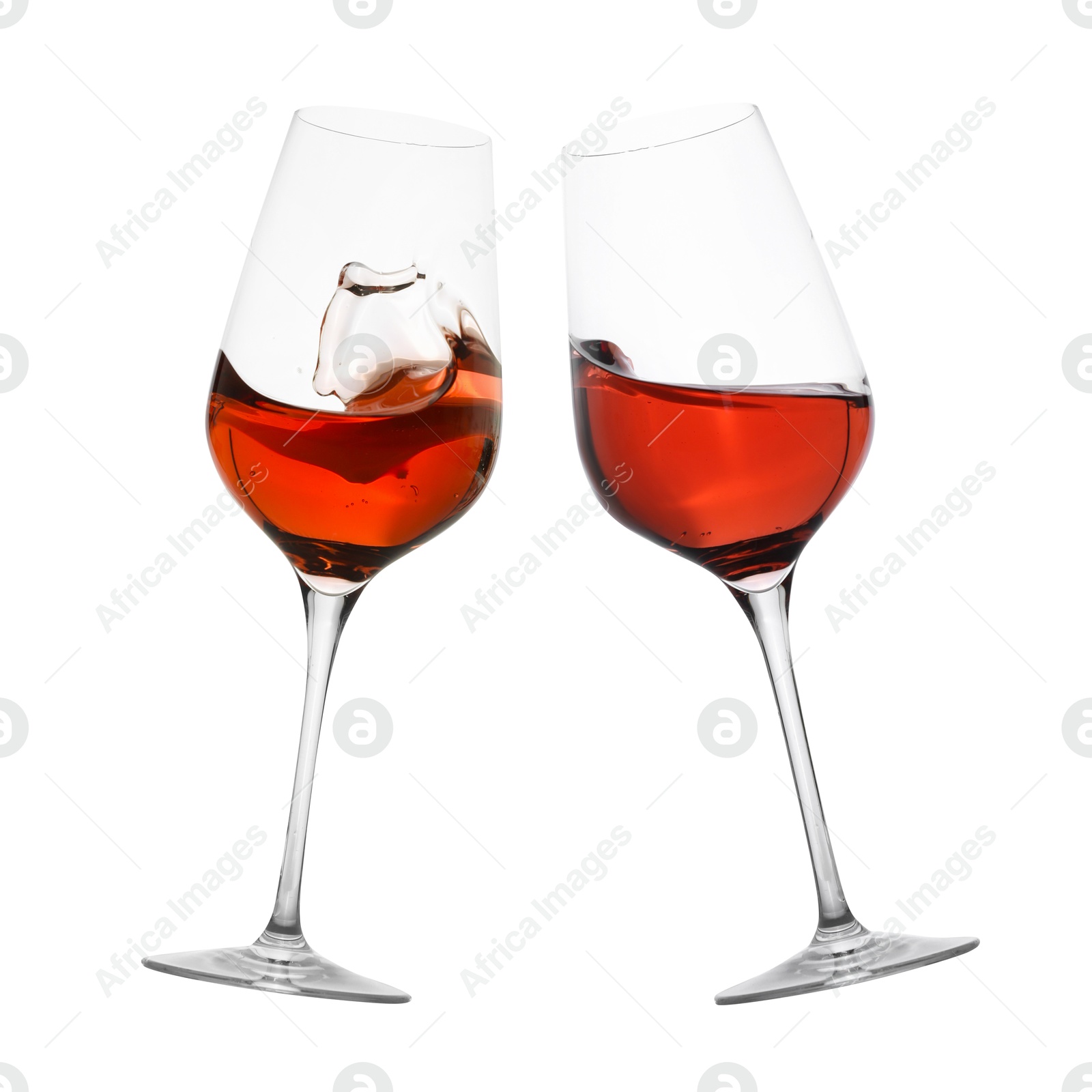 Image of Glasses of splashing red wine isolated on white