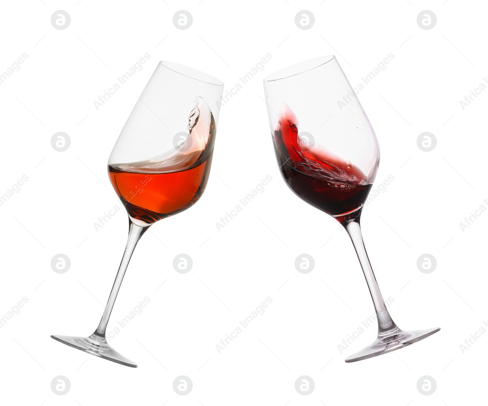 Image of Glasses of splashing red wine isolated on white