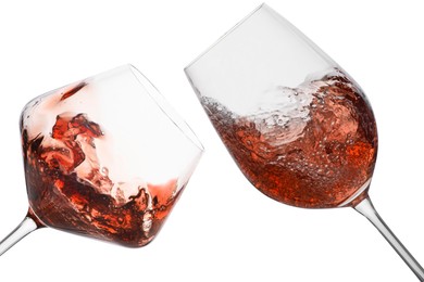 Image of Glasses of splashing red wine isolated on white