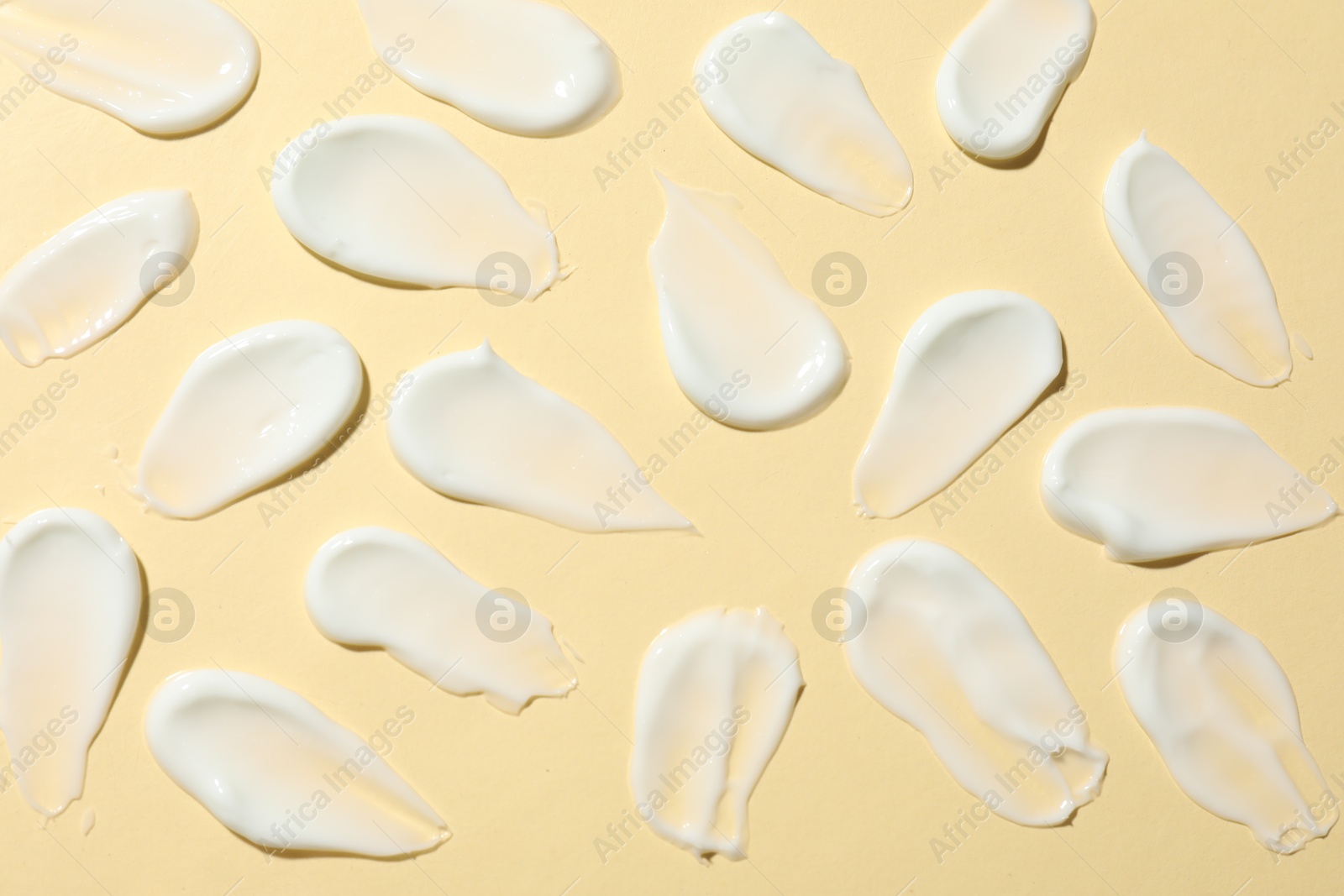 Photo of Body cream on beige background, flat lay