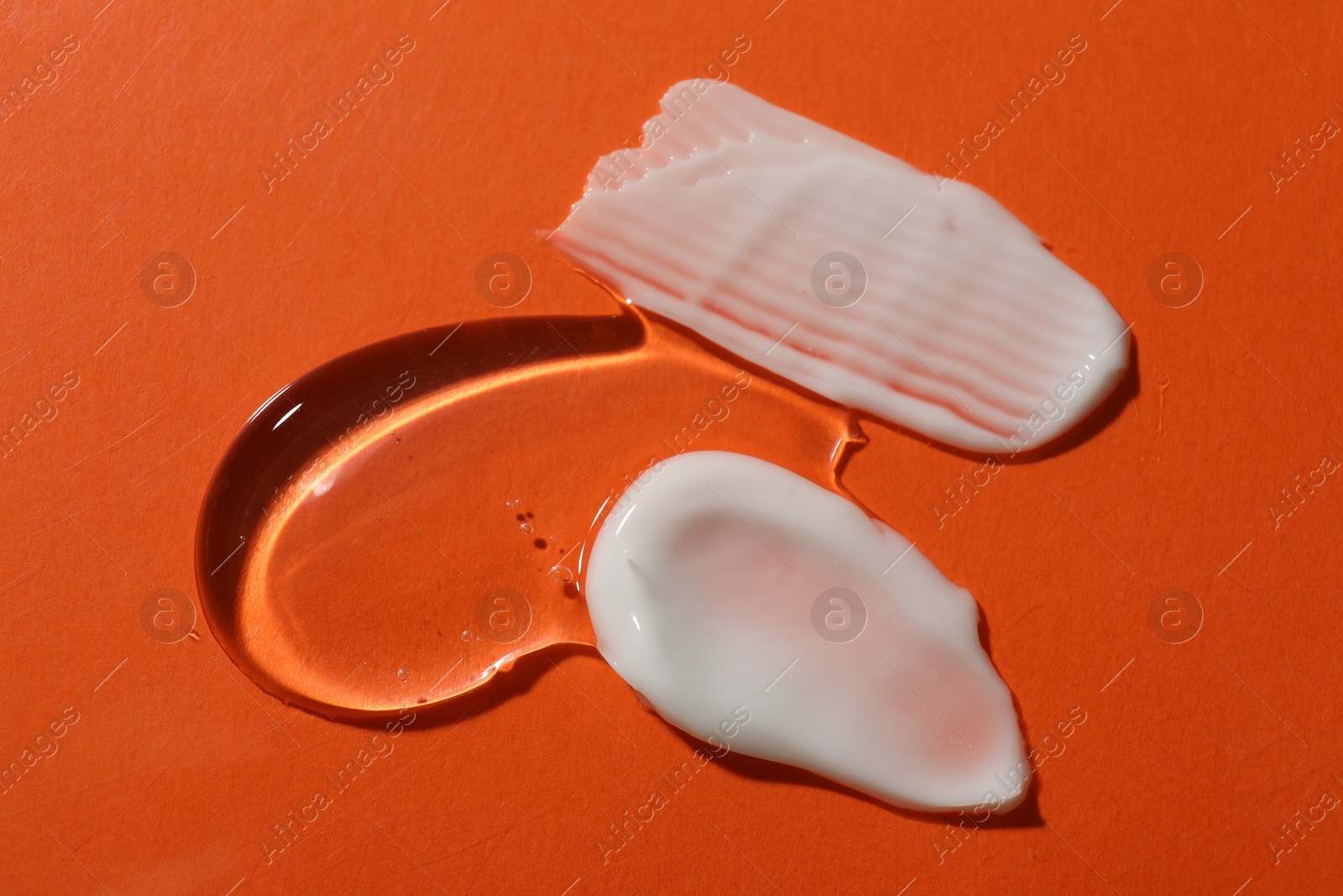 Photo of Body cream on red background, flat lay