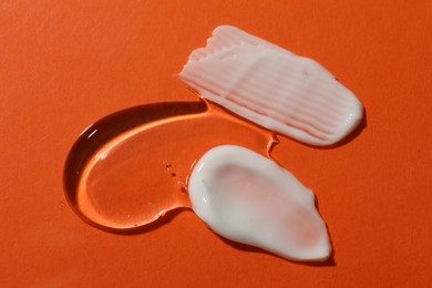 Photo of Body cream on red background, flat lay