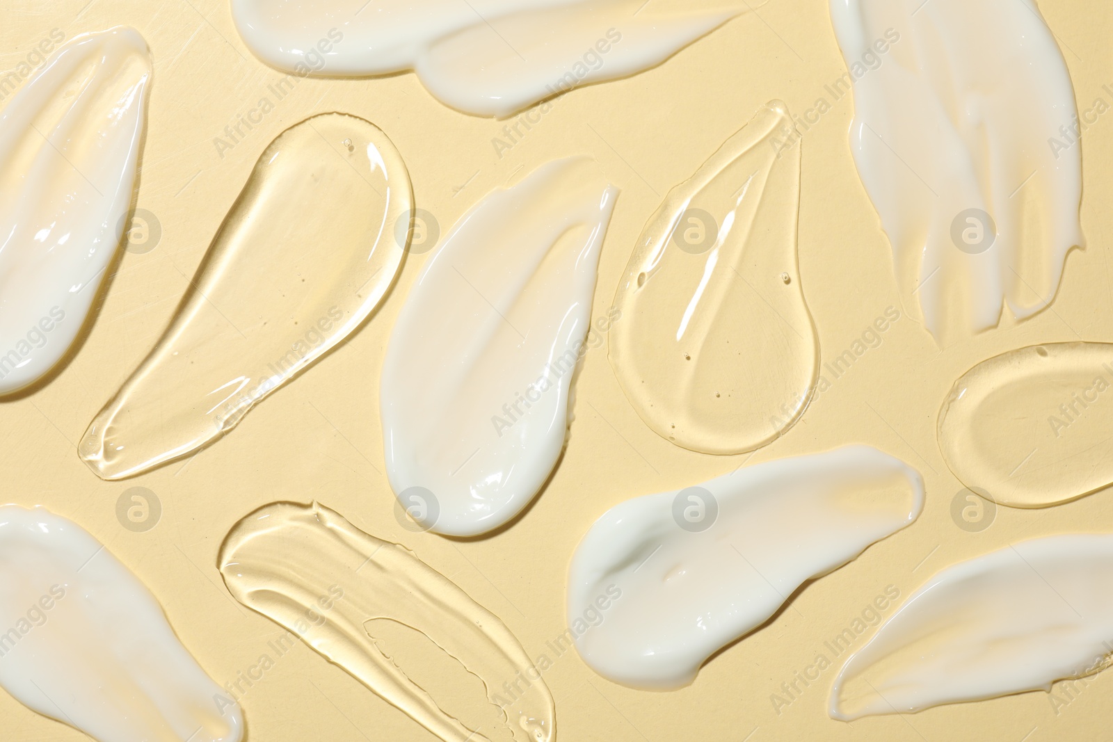 Photo of Body cream and gel on beige background, flat lay