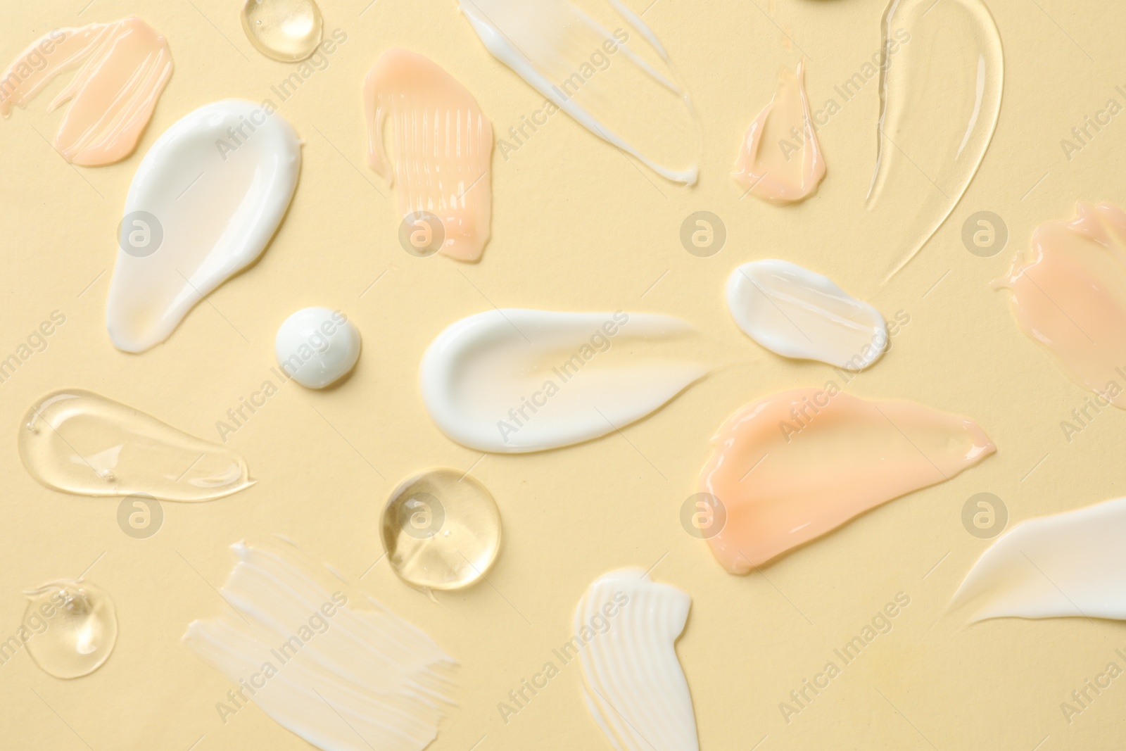 Photo of Different cosmetic products on beige background, flat lay