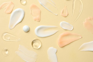 Photo of Different cosmetic products on beige background, flat lay