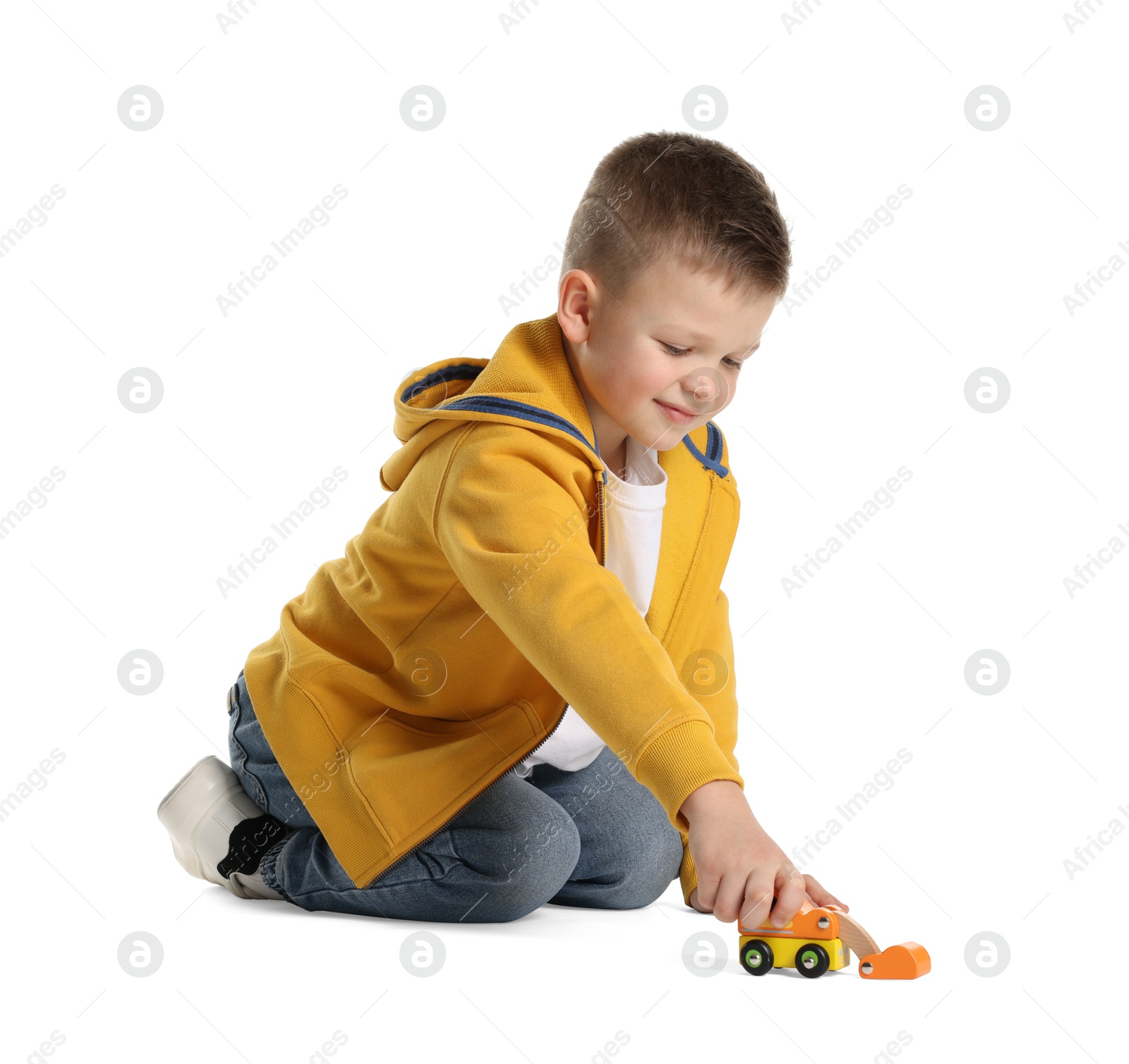 Photo of Little boy playing with toy car on white background