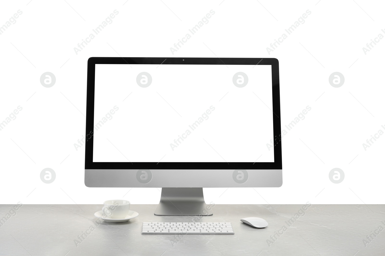 Photo of Computer monitor, keyboard, mouse and cup of drink on grey desk against white background