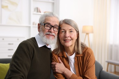 Photo of Portrait of happy elderly couple at home