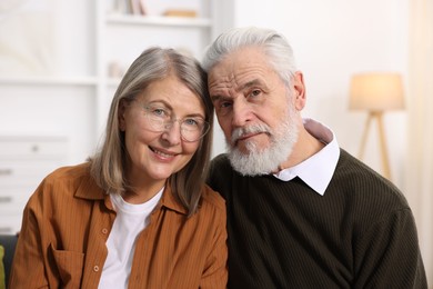 Photo of Portrait of happy elderly couple at home