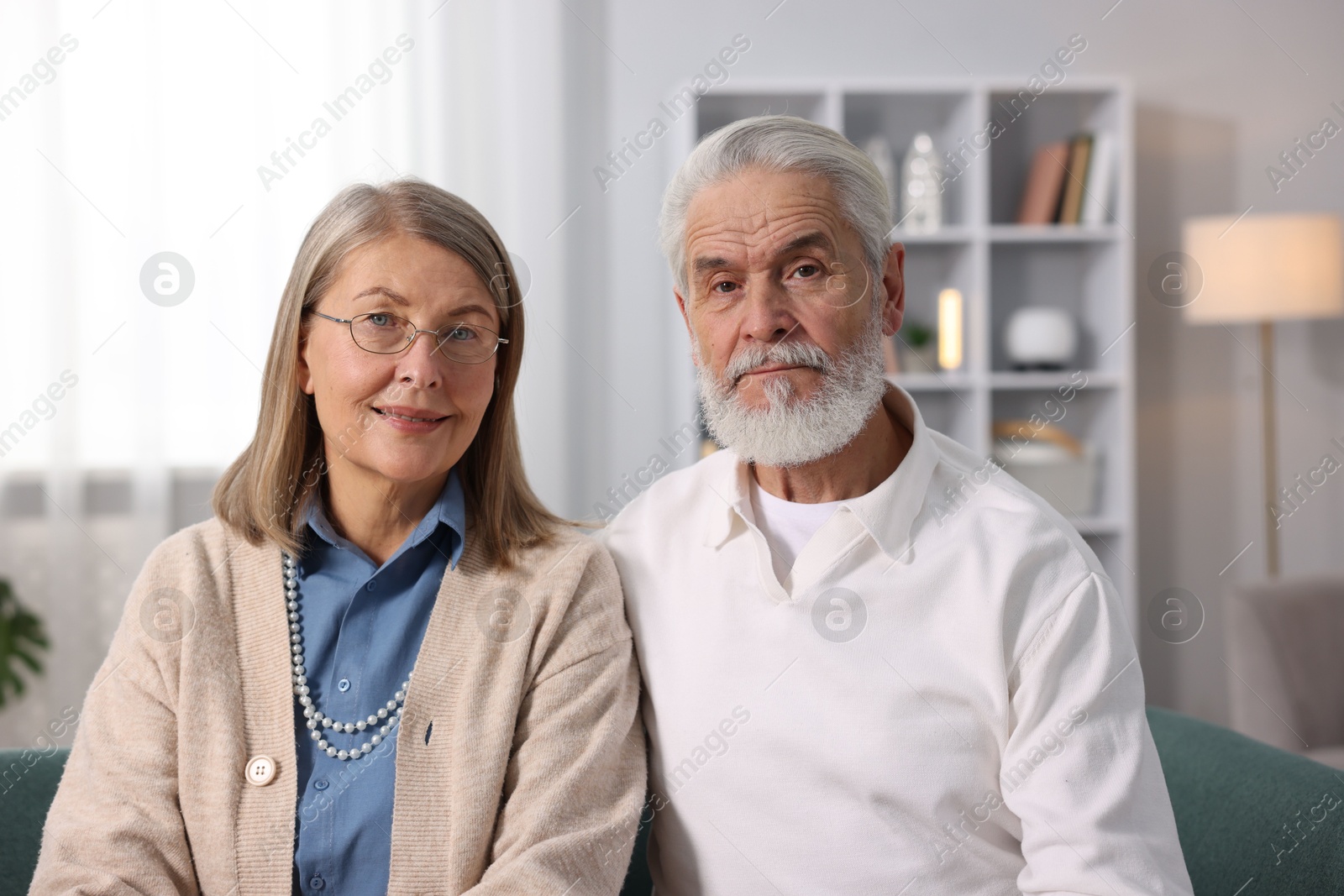 Photo of Portrait of happy elderly couple at home