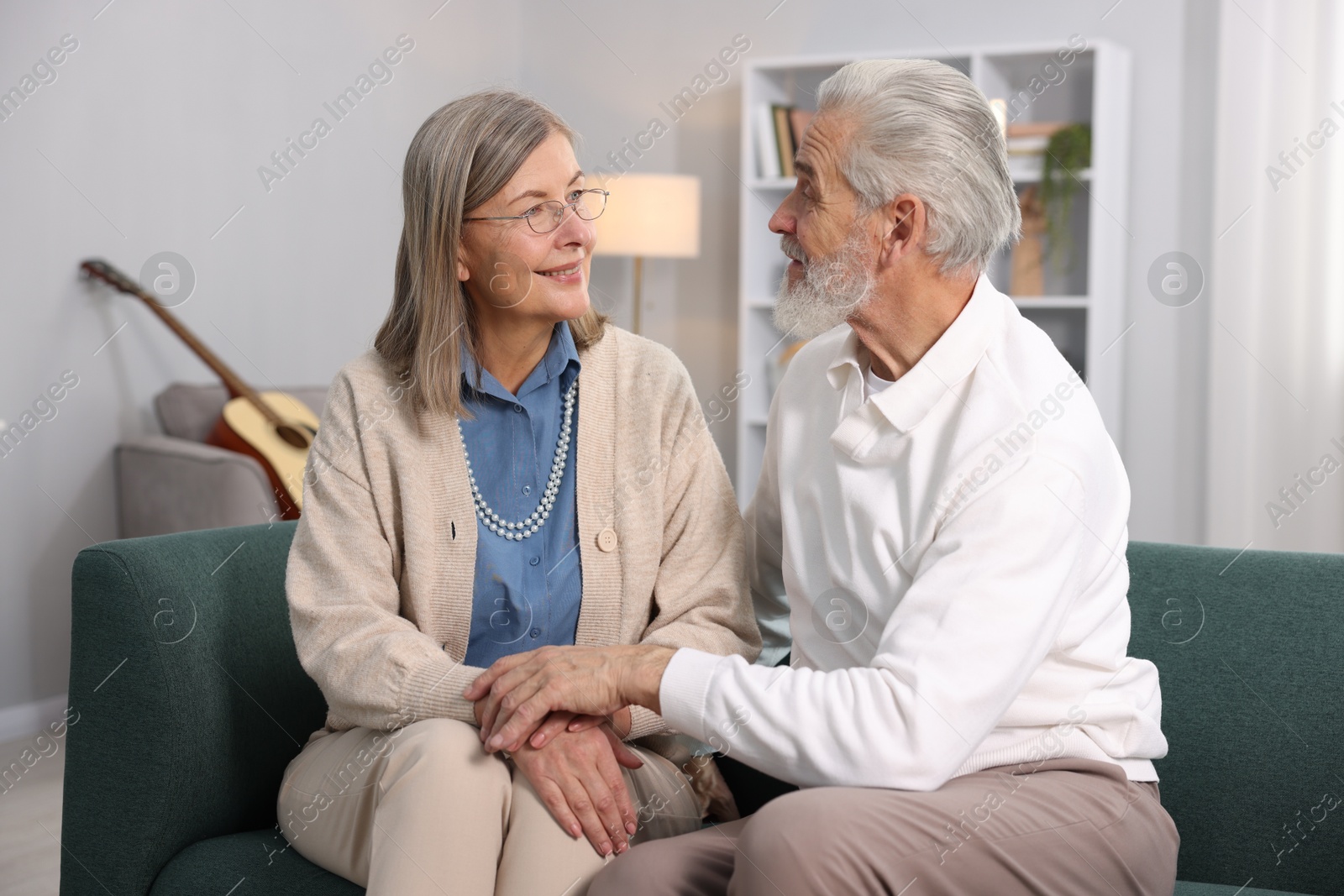 Photo of Cute elderly couple on sofa at home