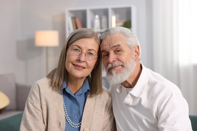 Photo of Portrait of cute elderly couple at home