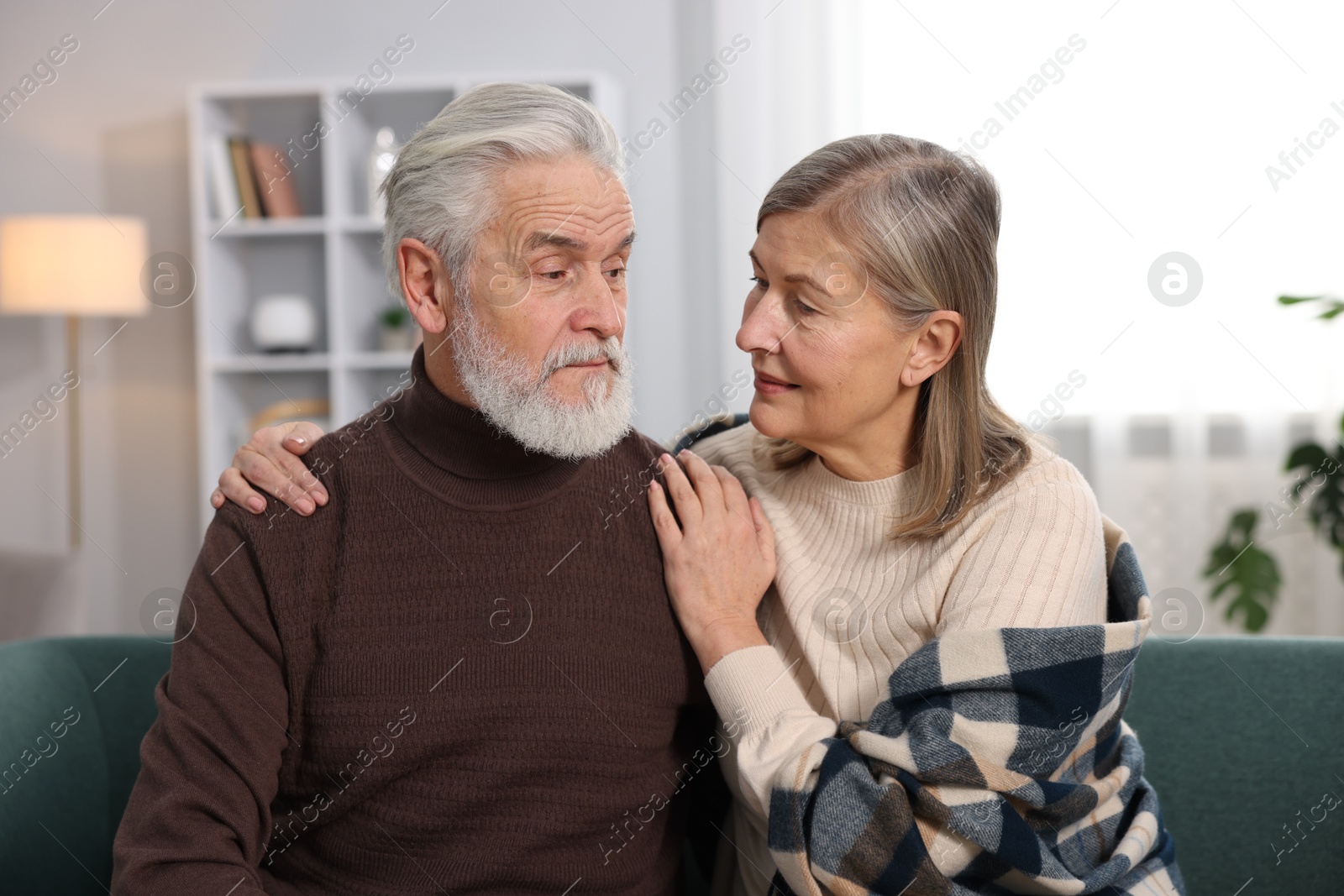 Photo of Cute elderly couple on sofa at home