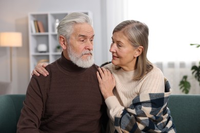 Photo of Cute elderly couple on sofa at home