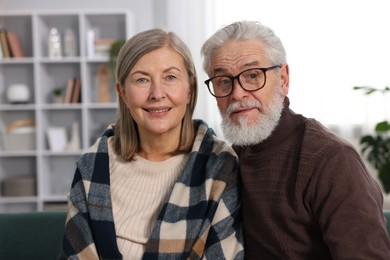 Photo of Portrait of happy elderly couple at home