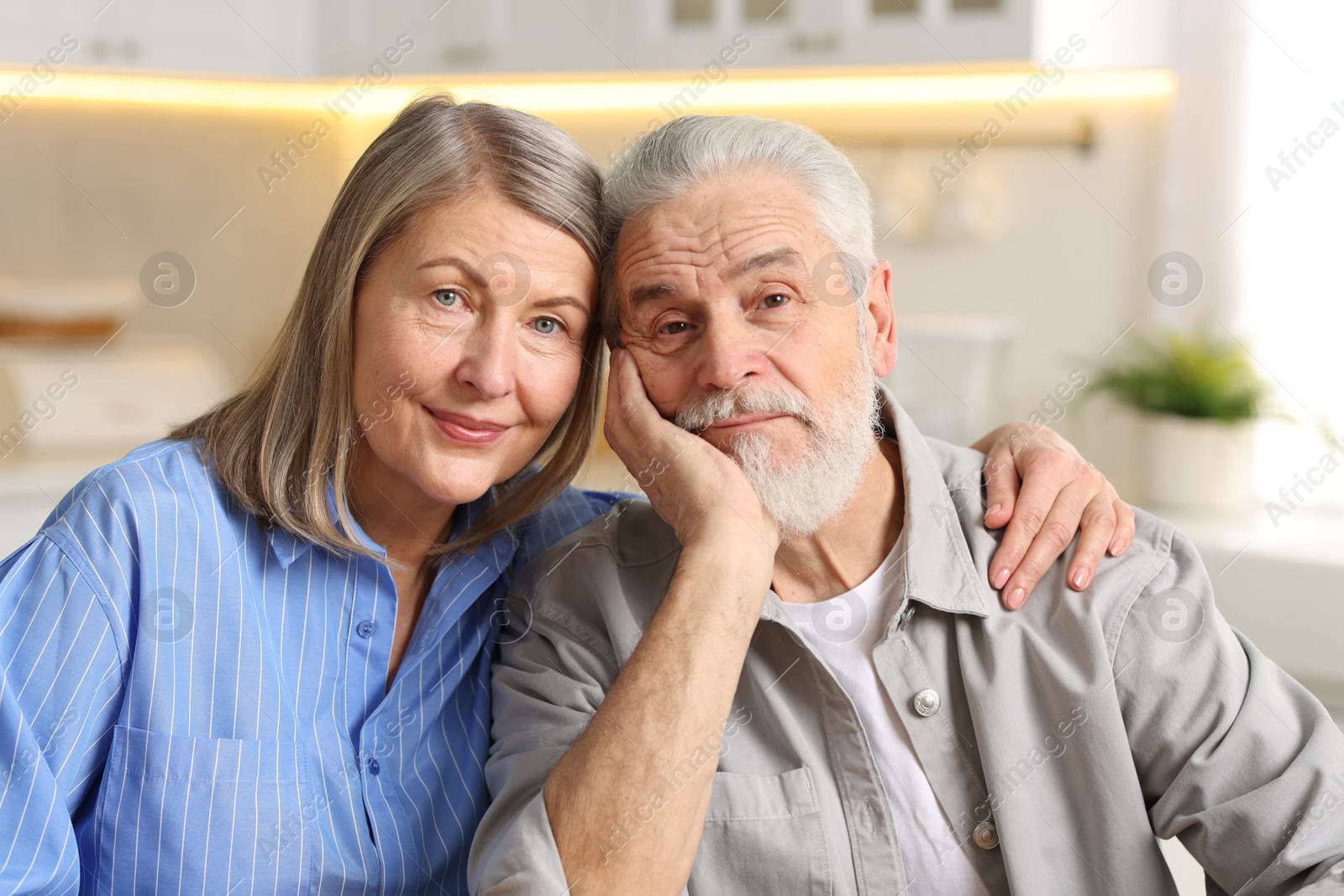 Photo of Portrait of cute elderly couple at home