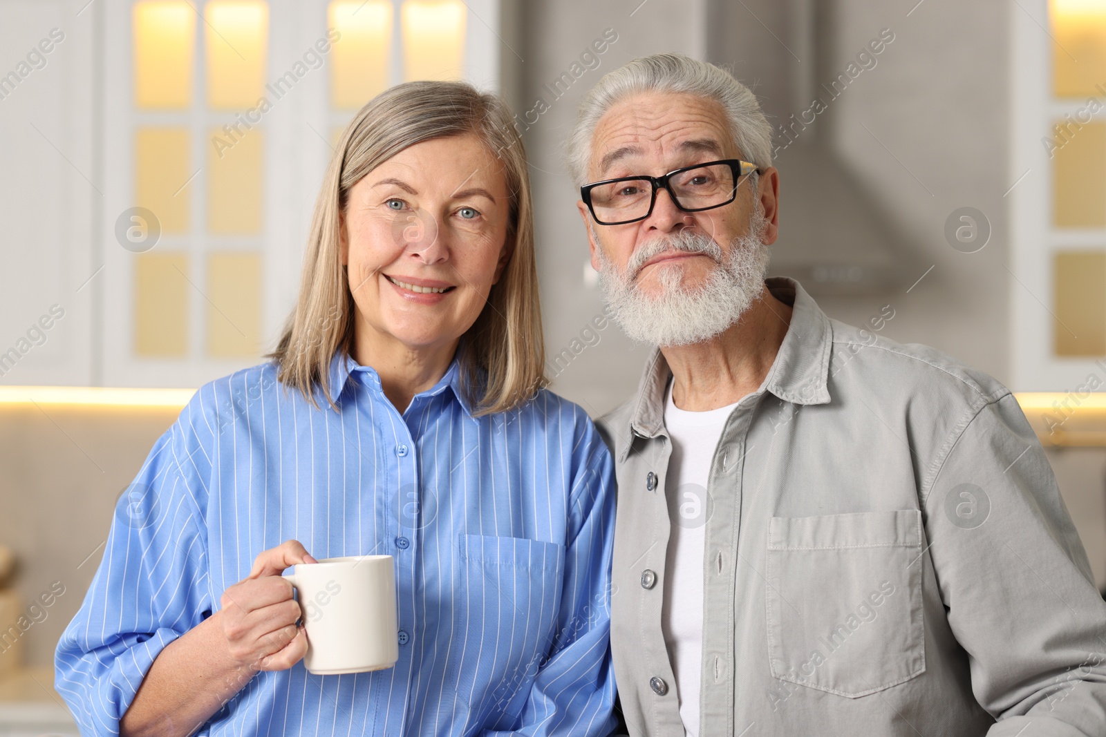 Photo of Portrait of happy elderly couple at home