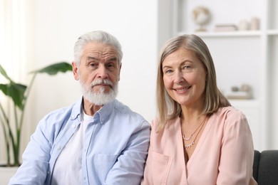 Photo of Portrait of happy elderly couple at home