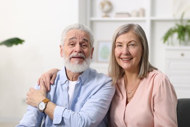 Photo of Portrait of happy elderly couple at home