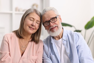 Photo of Cute elderly couple enjoying time together at home