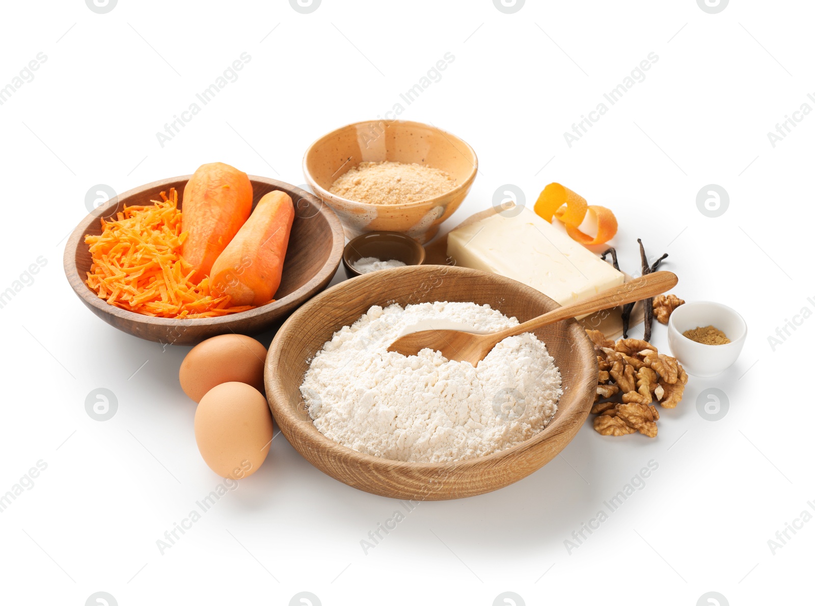 Photo of Different ingredients for making carrot cake isolated on white