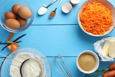 Photo of Frame of different ingredients for making carrot cake on light blue wooden table, flat lay