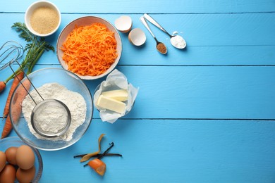 Photo of Different ingredients for making carrot cake on light blue wooden table, flat lay. Space for text