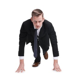 Photo of Businessman in starting position for run ready for competition on white background