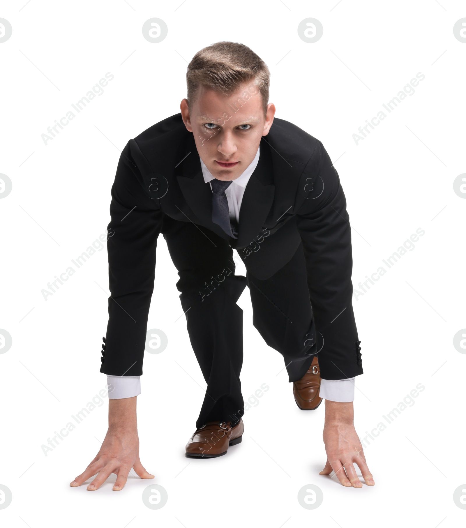 Photo of Businessman in starting position for run ready for competition on white background