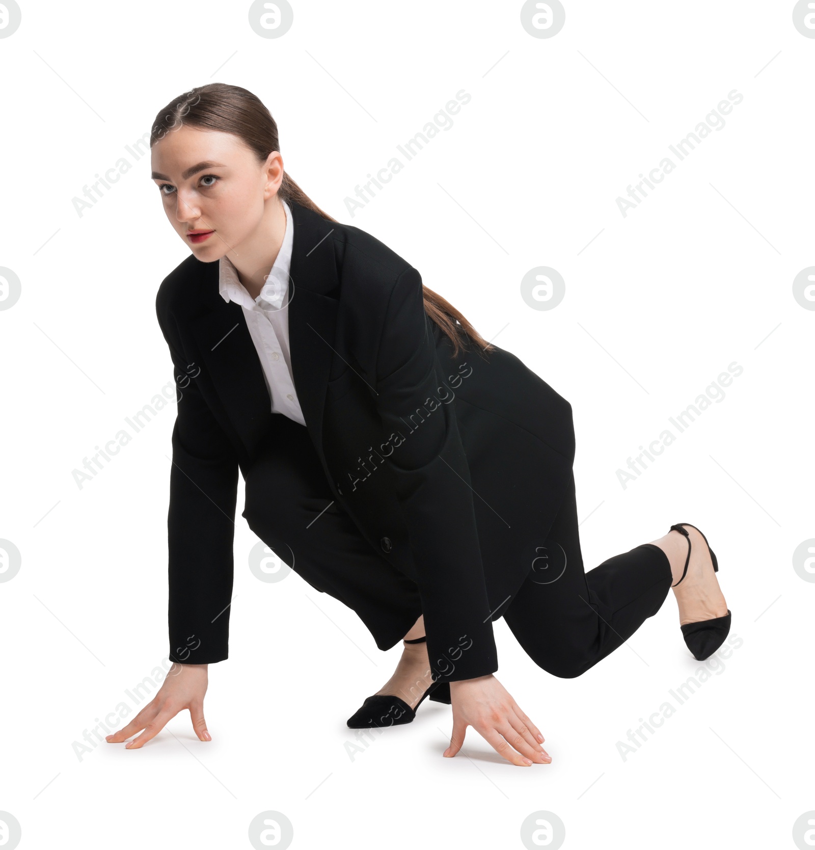 Photo of Businesswoman in starting position for run ready for competition on white background