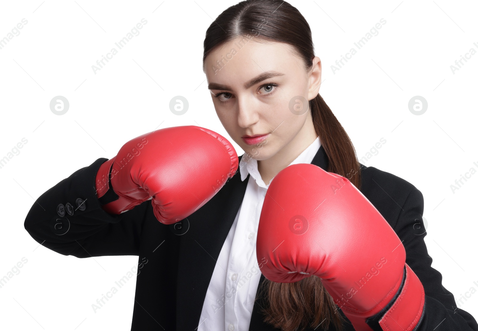 Photo of Competition. Businesswoman in suit wearing boxing gloves on white background