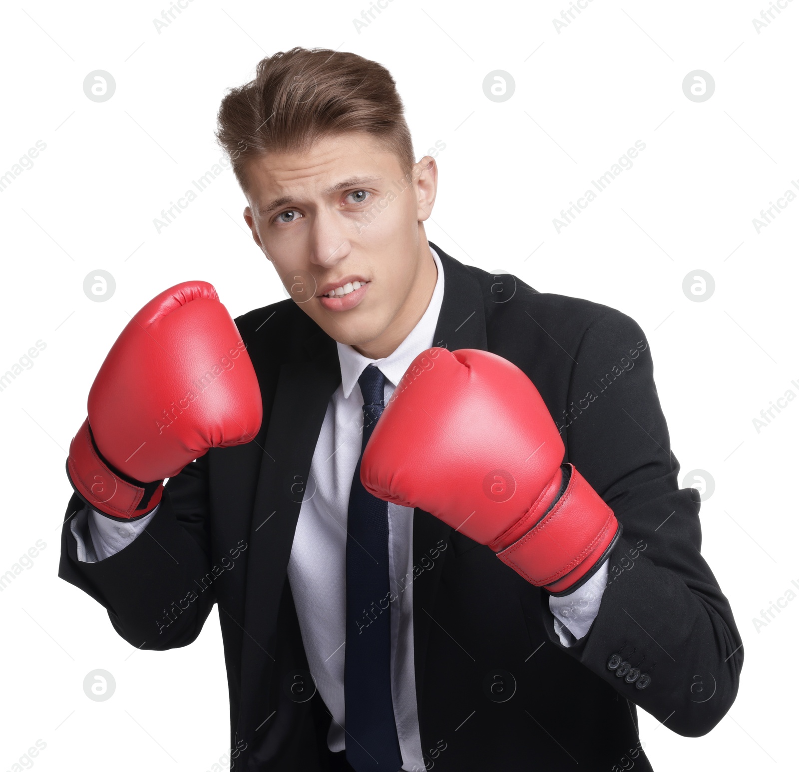 Photo of Competition. Businessman in suit wearing boxing gloves on white background