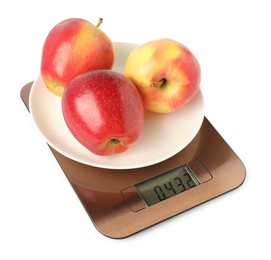 Photo of Electronic kitchen scale with plate of apples isolated on white