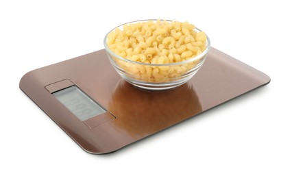 Photo of Electronic kitchen scale with bowl of raw pasta isolated on white